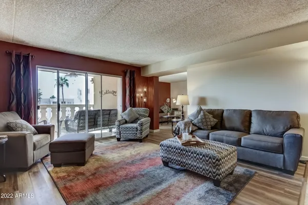 a living room with furniture and a large window
