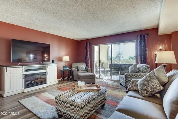 a living room with furniture and a fireplace