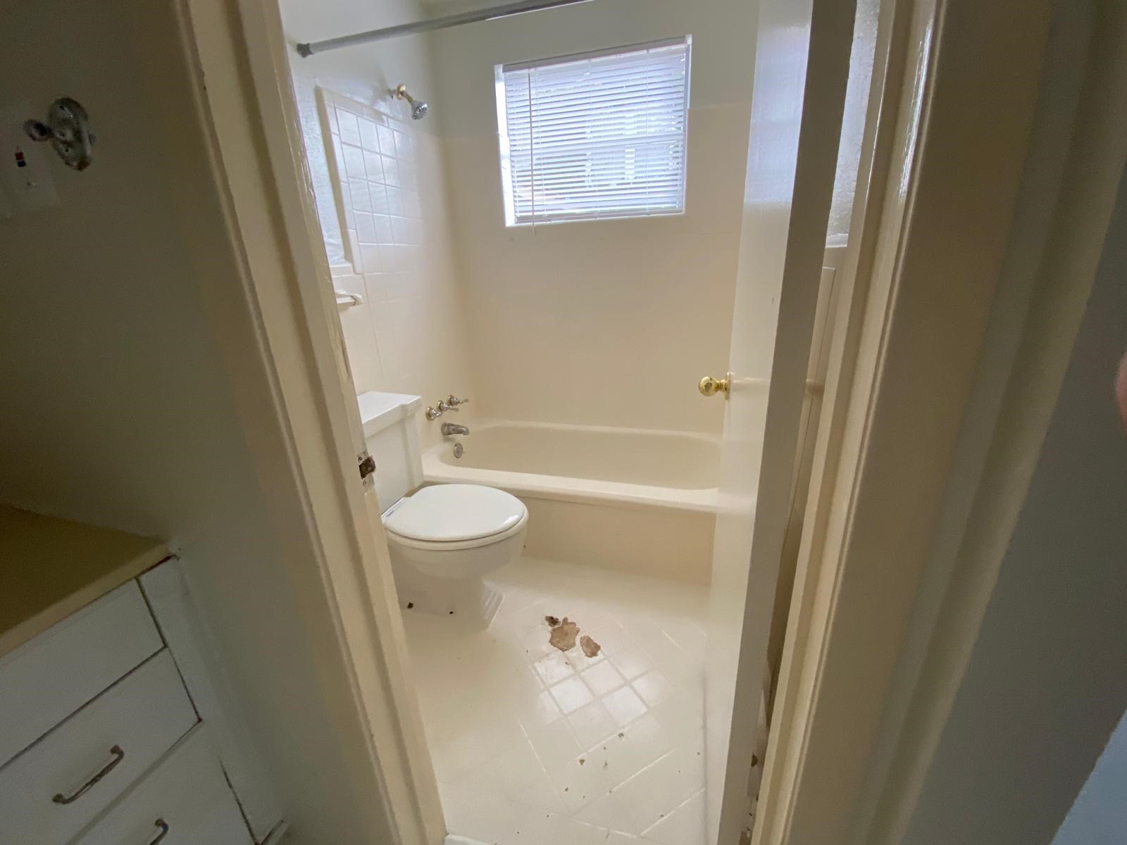 1909 Colquitt Street, Unit 3 Houston, TX 77098 - Photo 12 of 16 a bathroom with a granite countertop sink toilet and shower