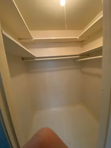 a backyard of a house with plants and outdoor seating