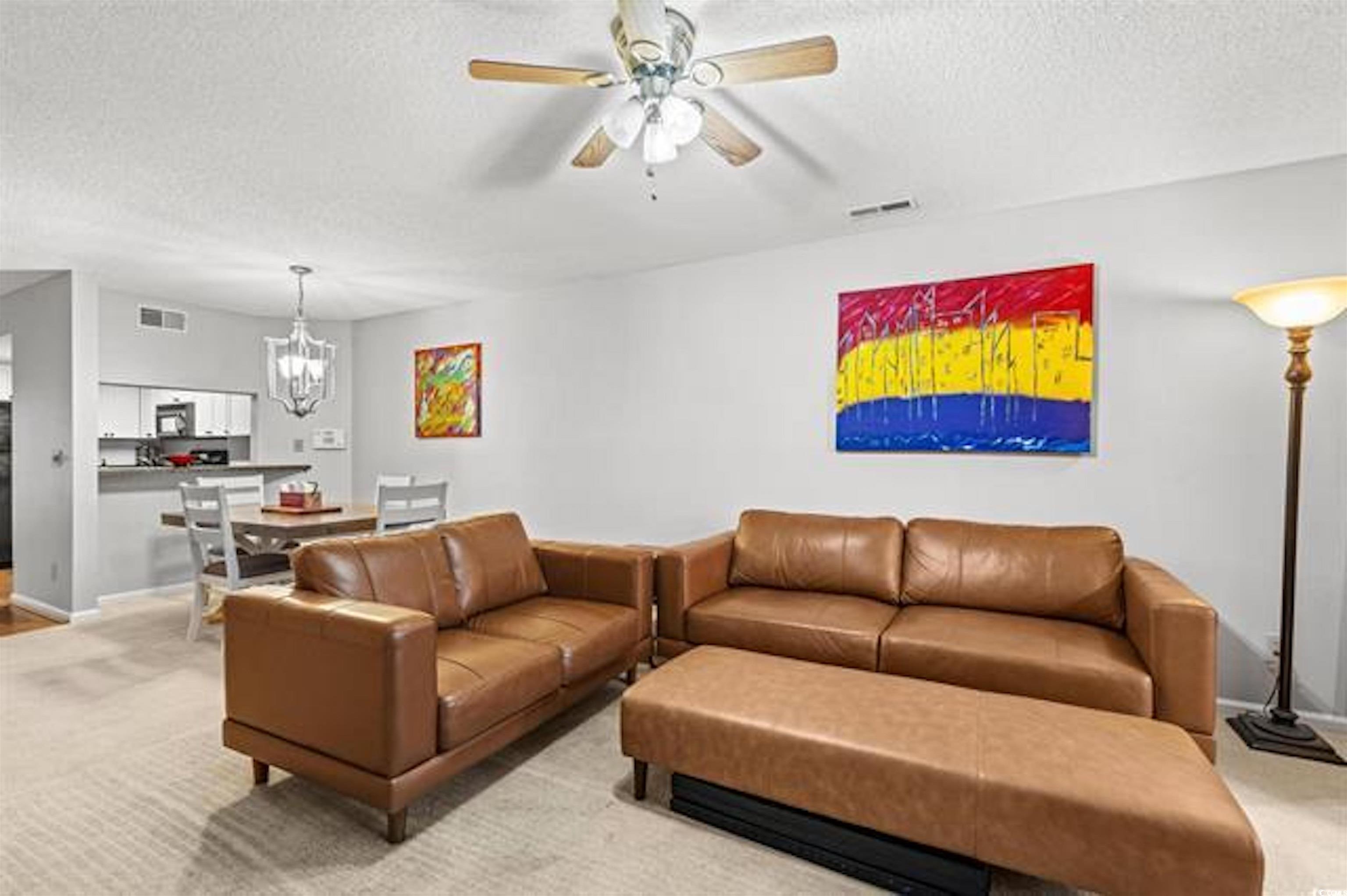 1100 Possum Trot Road, Unit B206 North Myrtle Beach, SC 29582 - Photo 3 of 16 Living room featuring a textured ceiling, ceiling