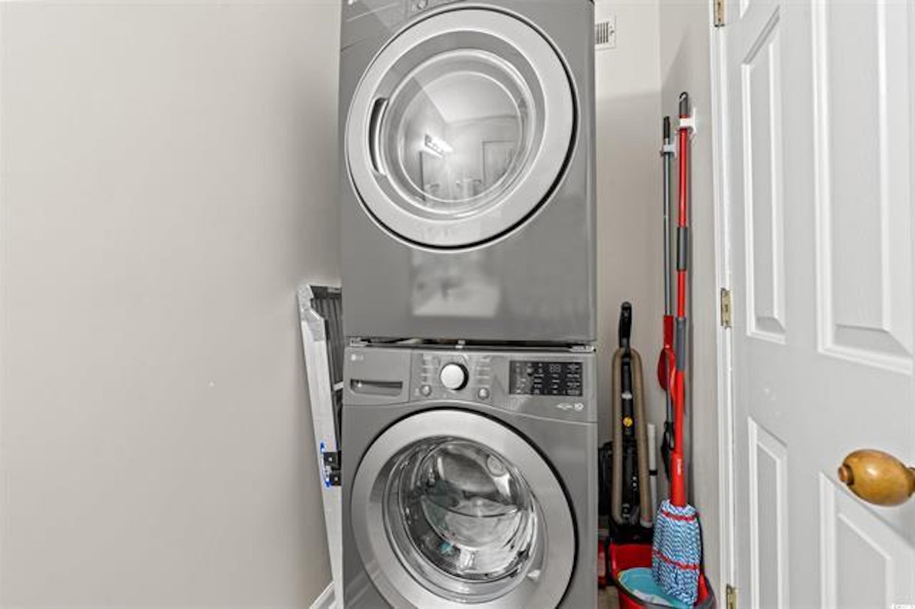 1100 Possum Trot Road, Unit B206 North Myrtle Beach, SC 29582 - Photo 8 of 16 Washroom featuring stacked washer and clothes drye