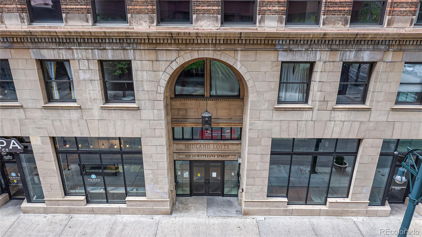 444 17th Street, Unit 301 Denver, CO 80202 - Photo 15 of 21 a front view of a building with glass windows