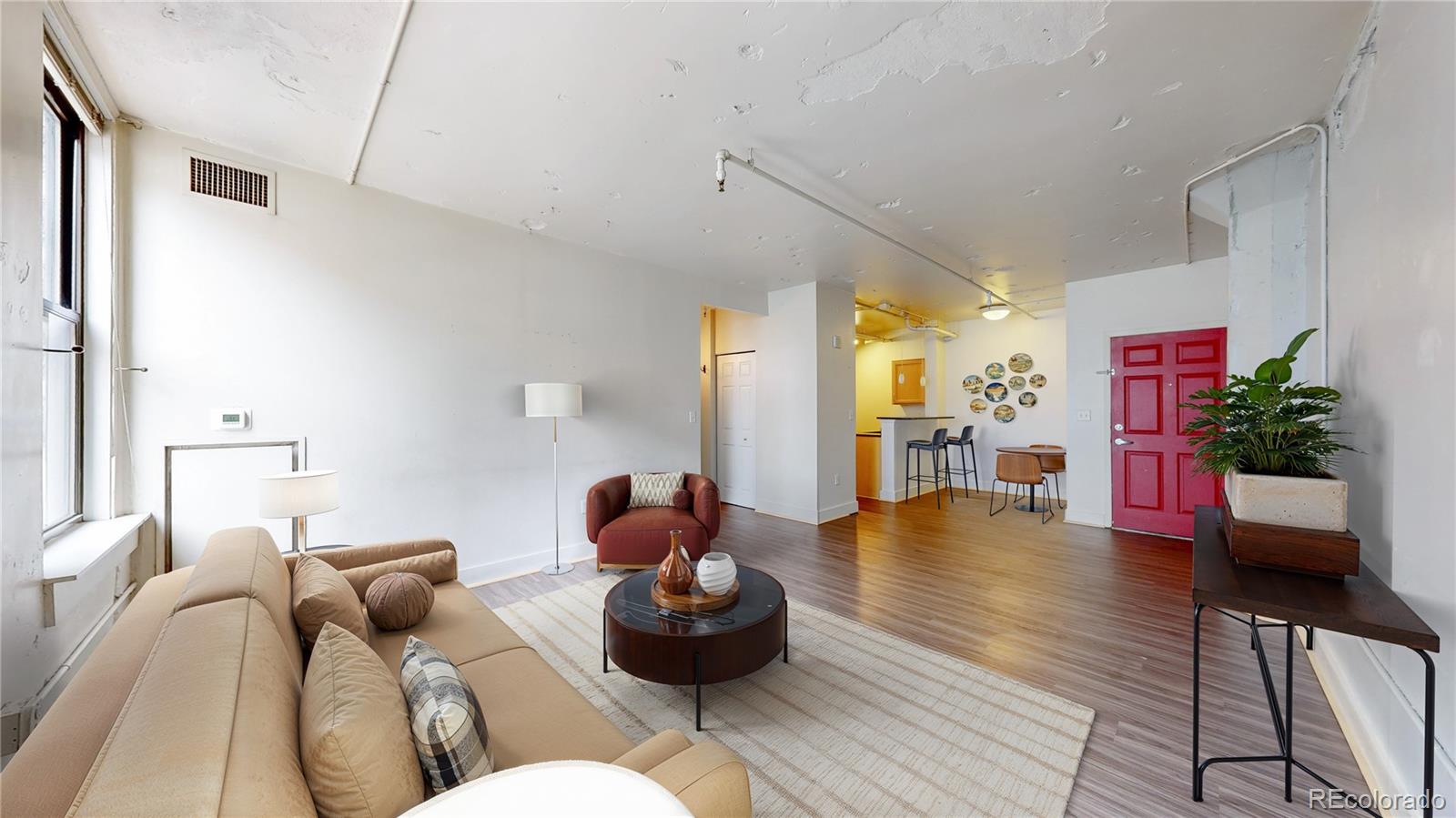 444 17th Street, Unit 301 Denver, CO 80202 - Photo 2 of 21 a living room with furniture and wooden floor