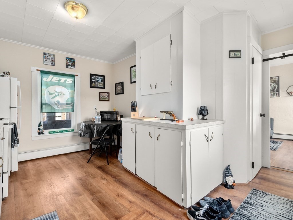 173 School Street Webster, MA 01570 - Photo 11 of 26 a view of kitchen with furniture and wooden floor