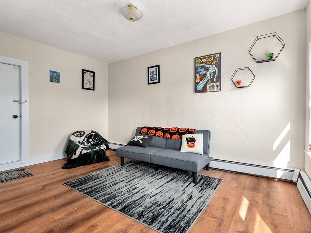 173 School Street Webster, MA 01570 - Photo 13 of 26 a bedroom with furniture and wooden floor