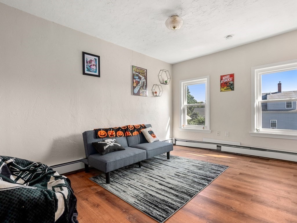 173 School Street Webster, MA 01570 - Photo 14 of 26 a bedroom with furniture and a rug