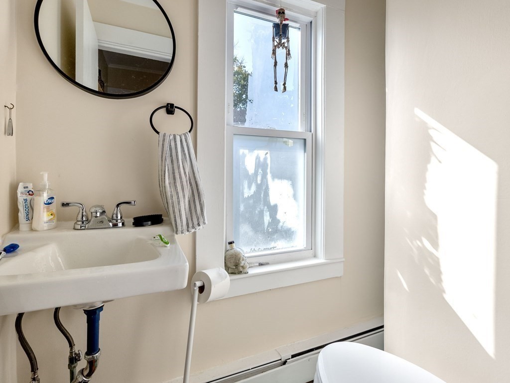 173 School Street Webster, MA 01570 - Photo 15 of 26 a bathroom with a sink and a mirror