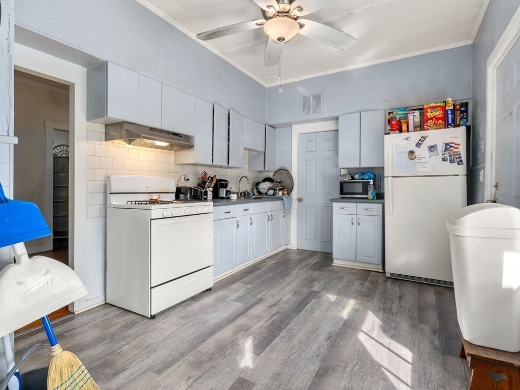 173 School Street Webster, MA 01570 - Photo 16 of 26 a kitchen with stainless steel appliances a refrigerator sink and cabinets