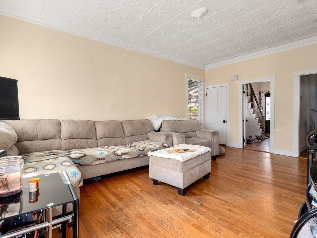 173 School Street Webster, MA 01570 - Photo 18 of 26 a living room with furniture and a wooden floor