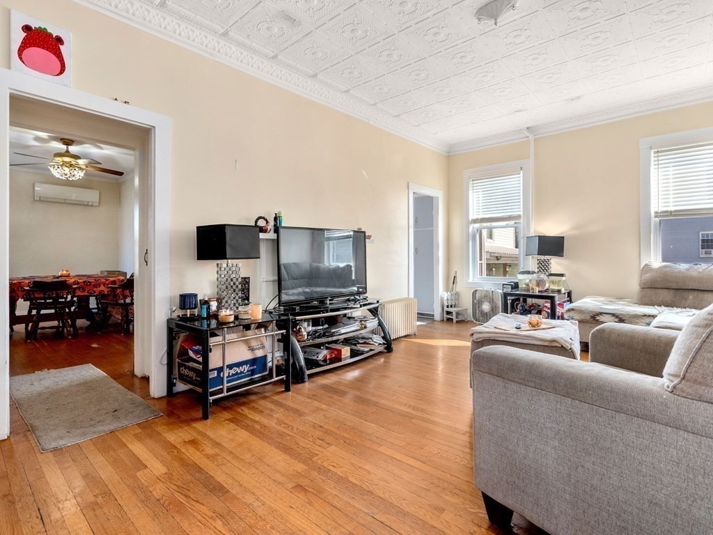 173 School Street Webster, MA 01570 - Photo 19 of 26 a living room with furniture and a flat screen tv