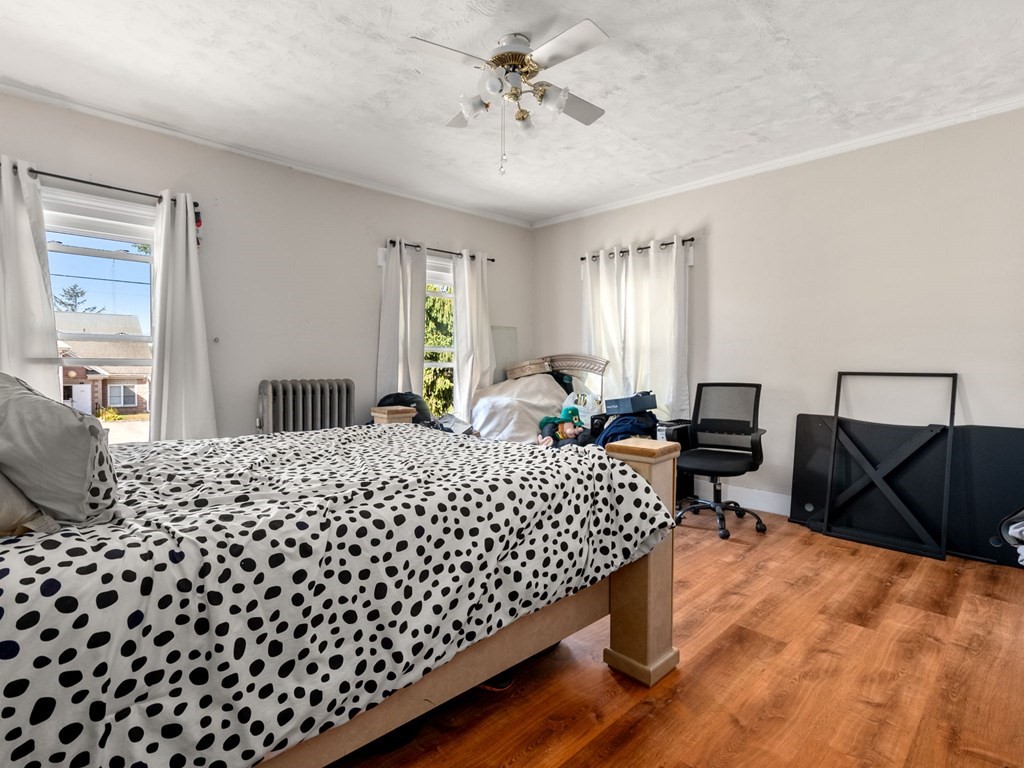 173 School Street Webster, MA 01570 - Photo 25 of 26 a bed room with a bed window and chair