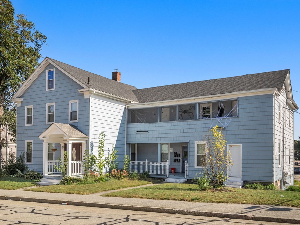 173 School Street Webster, MA 01570 - Photo 3 of 26 a front view of a house with a yard