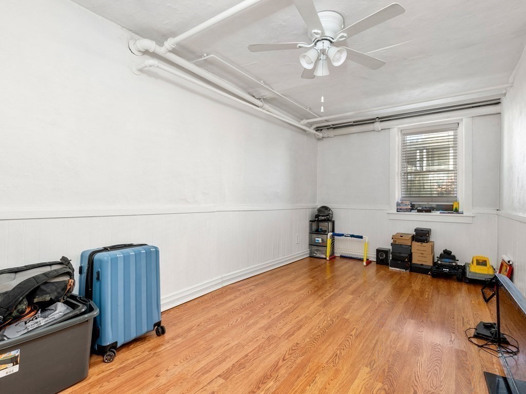 173 School Street Webster, MA 01570 - Photo 9 of 26 a workspace with furniture and wooden floor