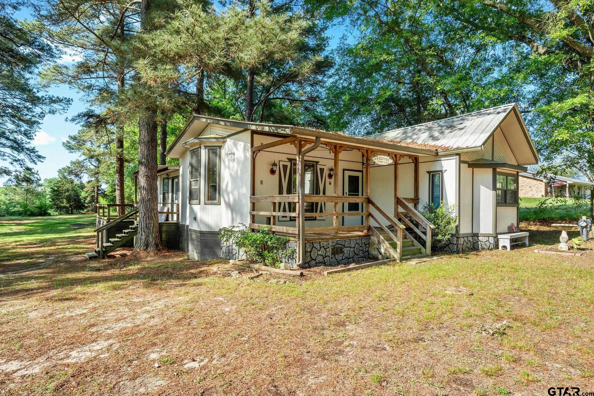 4550 Crabapple Road Gilmer, TX 75645 - Photo 28 of 33 front view of a house with a patio