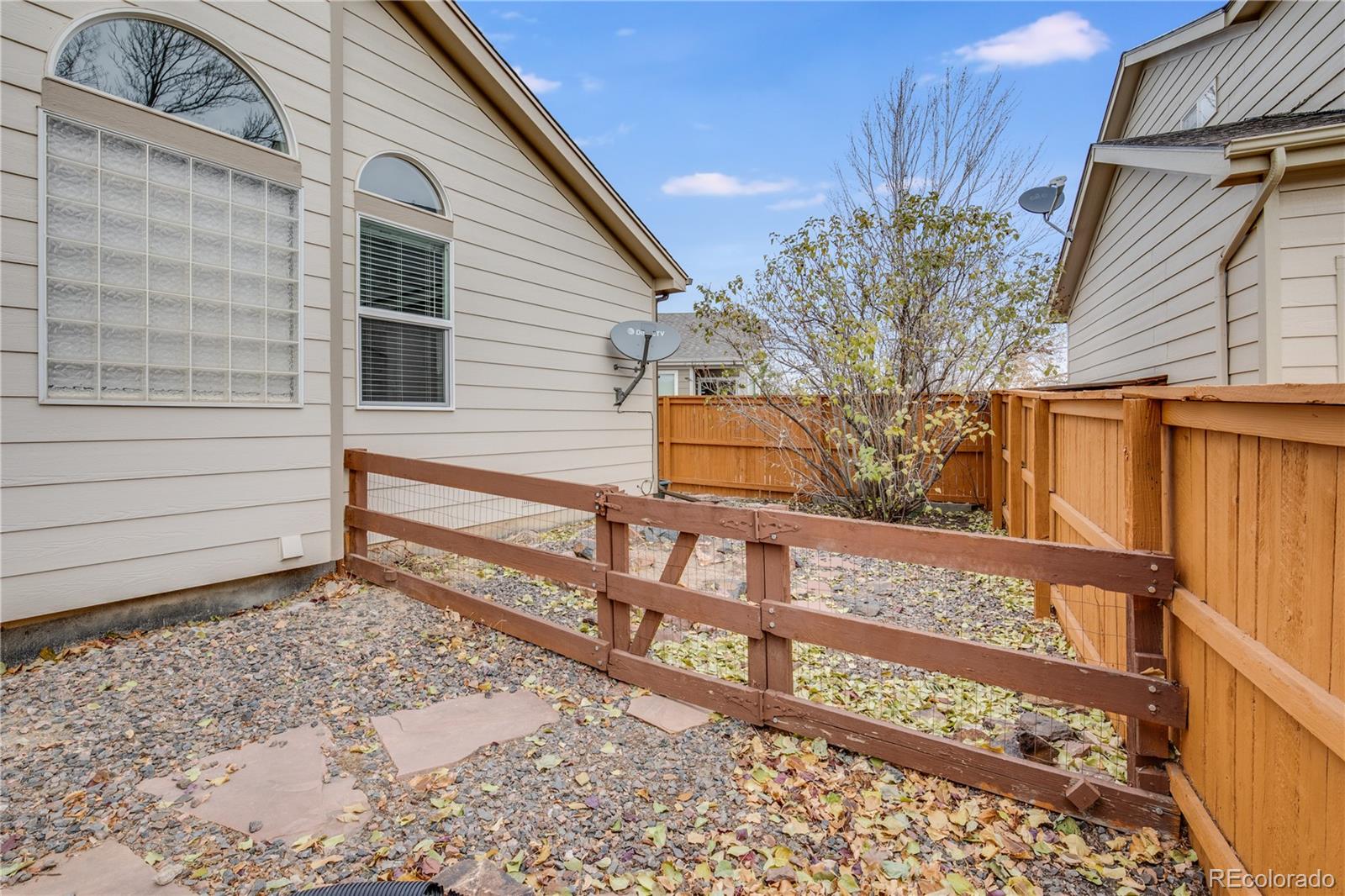 7135 Leopard Drive Lone Tree, CO 80124 - Photo 19 of 47 a view of a house with a fence