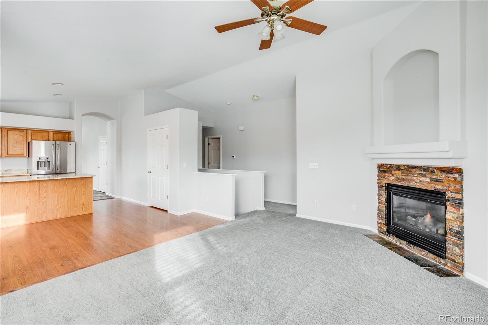 7135 Leopard Drive Lone Tree, CO 80124 - Photo 34 of 47 a view of a kitchen and an empty room
