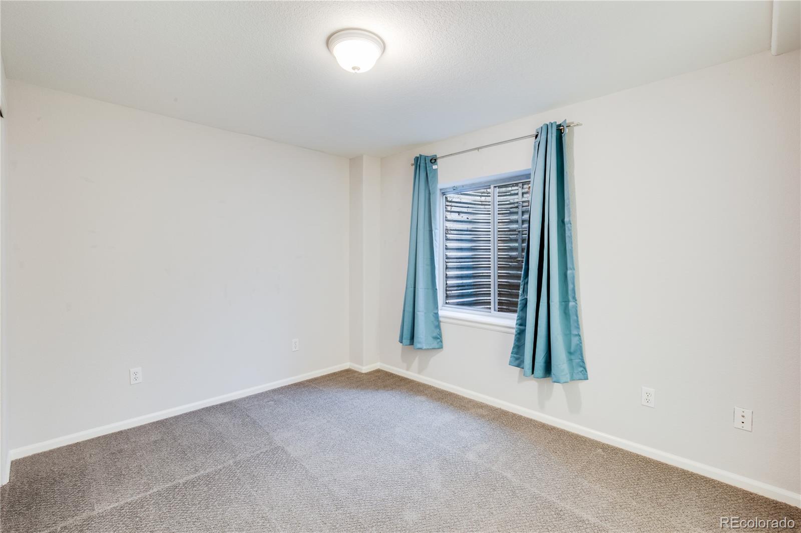7135 Leopard Drive Lone Tree, CO 80124 - Photo 39 of 47 an empty room with windows
