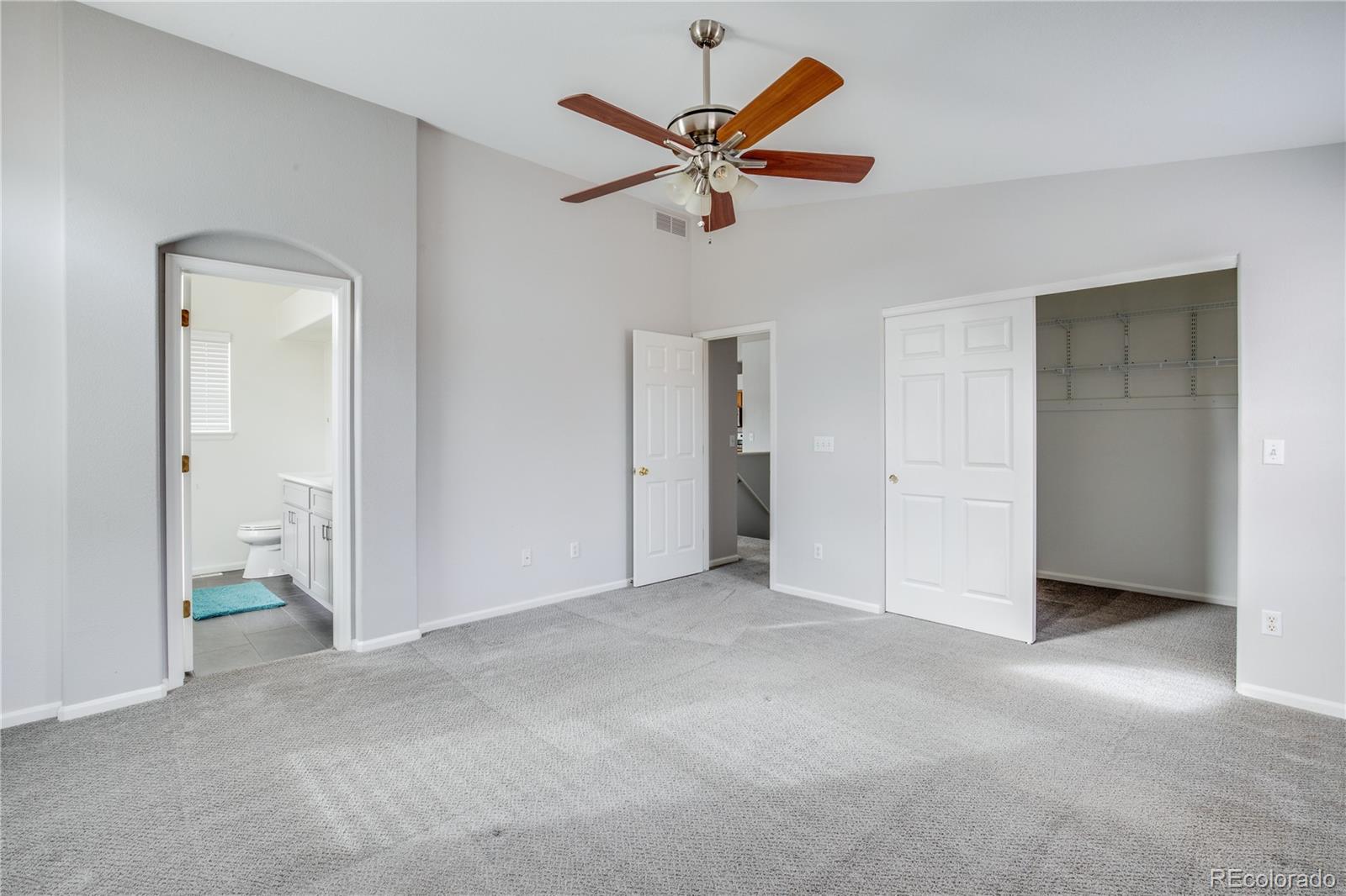 7135 Leopard Drive Lone Tree, CO 80124 - Photo 8 of 47 an empty room and chandelier fan