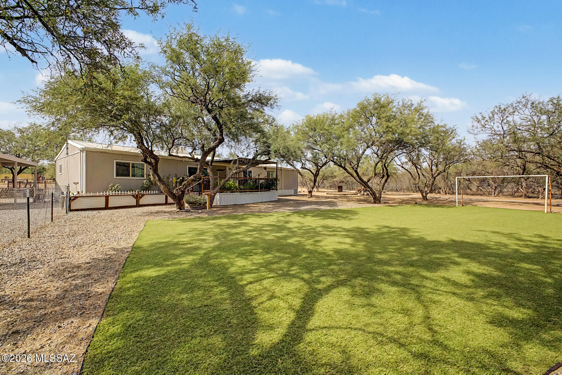 4231 East Pinal Street Tucson, AZ 85739 - Photo 2 of 36 a view of outdoor space with garden and trees
