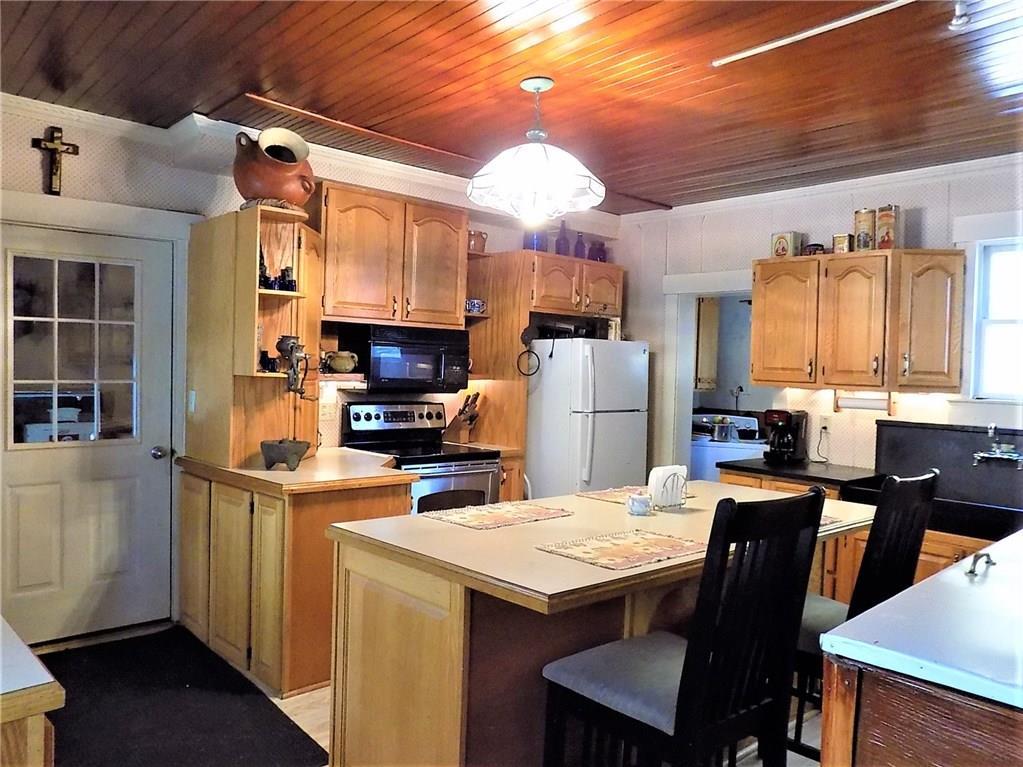 20 Maple Street Dexter, ME 04930 - Photo 6 of 35 The large island is the central hang...