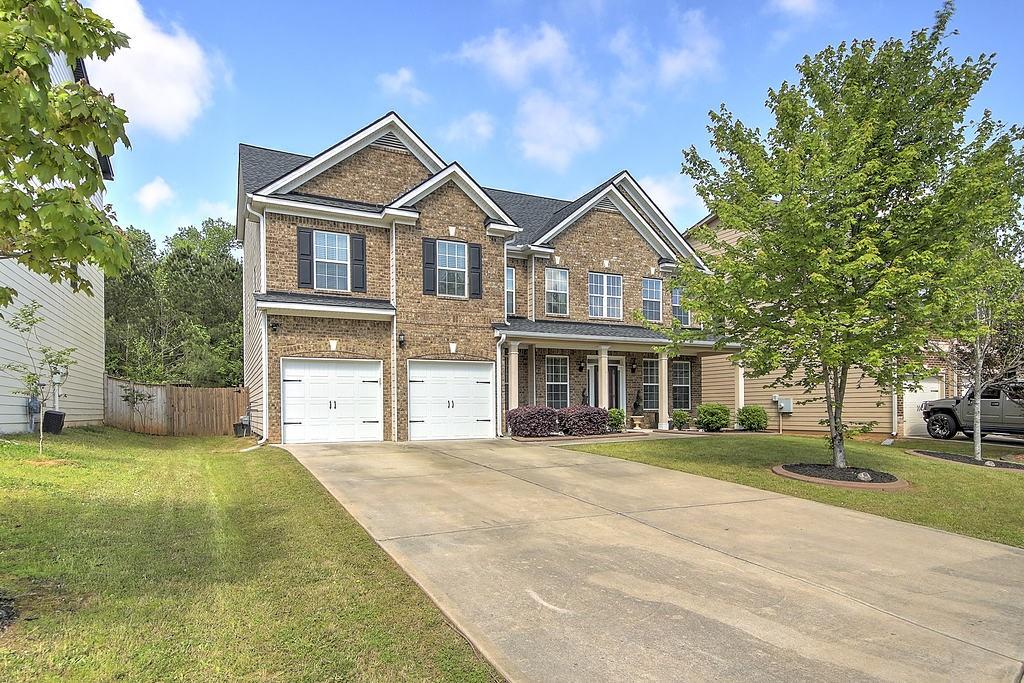 4340 Sublime Trail South Fulton, GA 30349 - Photo 1 of 1 a front view of a house with a yard