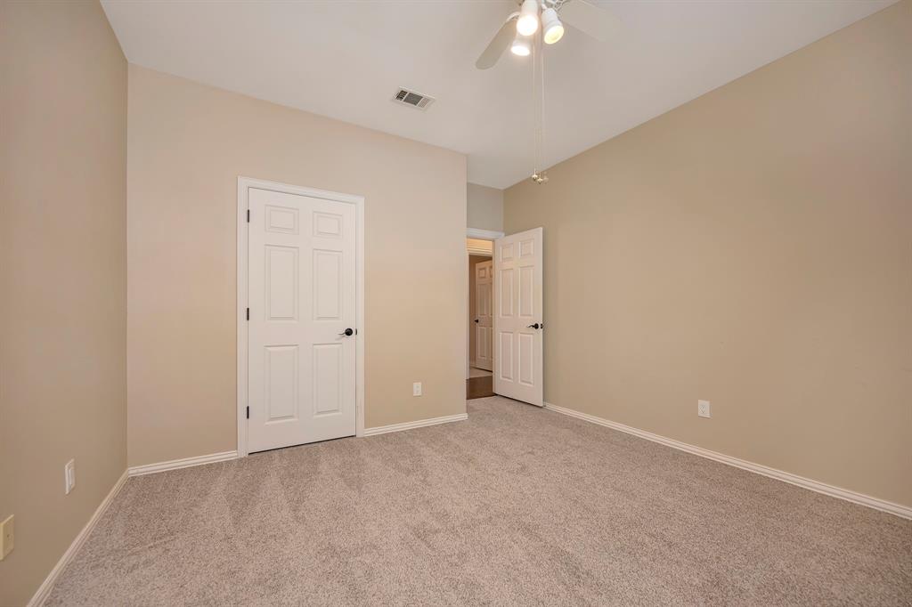 4008 Ramsgate Court Colleyville, TX 76034 - Photo 24 of 33 Upstairs bedroom with neutral-toned walls, white trim, and a ceiling fan with integrated lighting