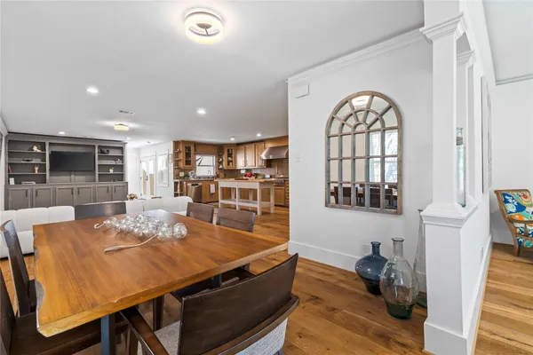 a dining room with furniture and a window