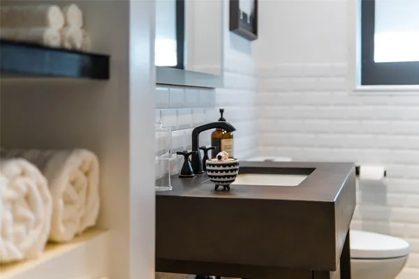 a close view of a sink and a table in a bathroom