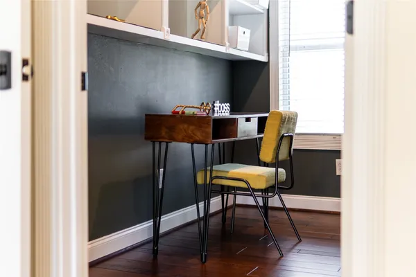 a room with furniture and a wooden floor