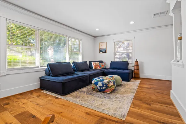 a living room with furniture and a rug
