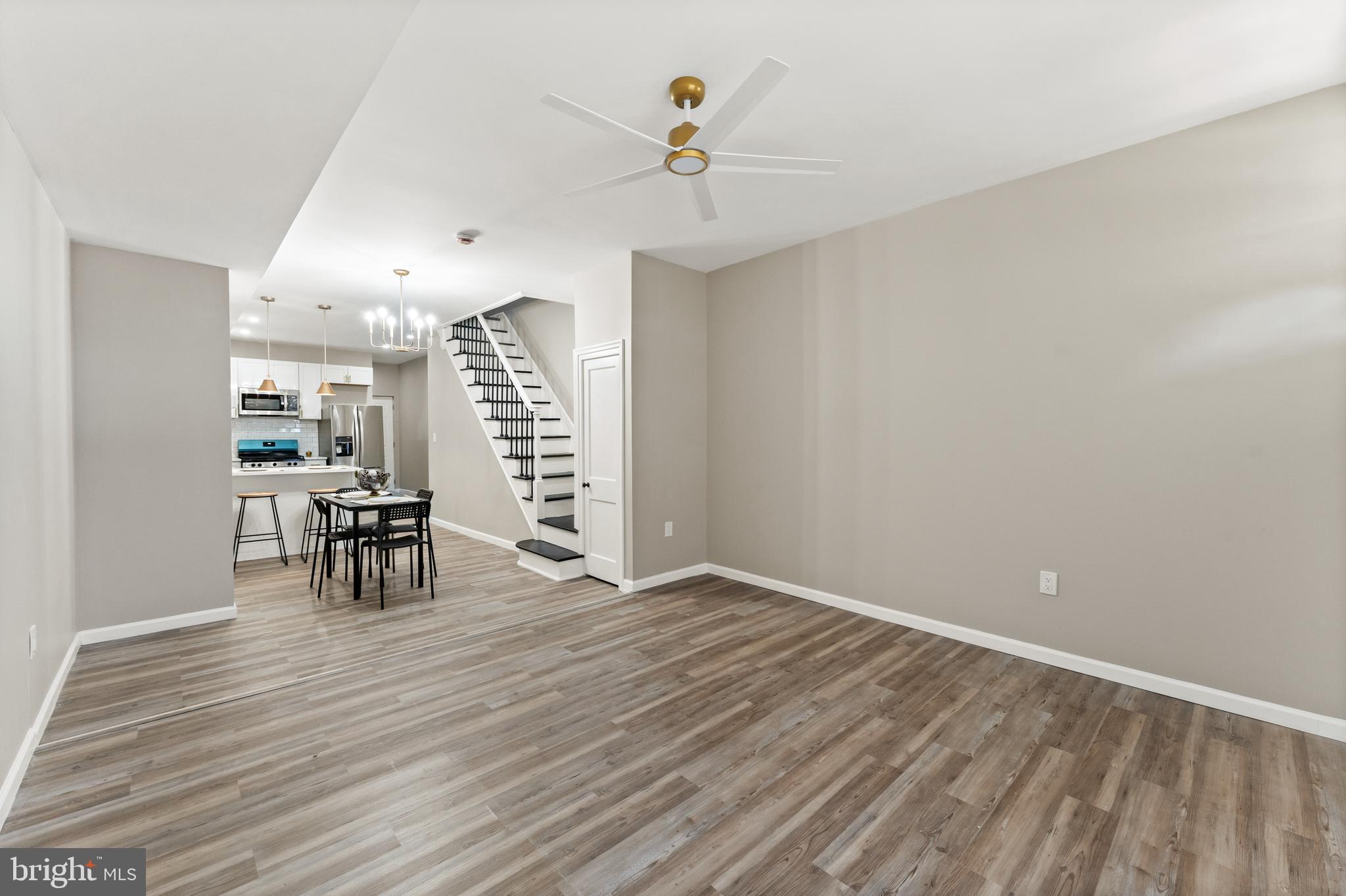 602 Denison Street Baltimore, MD 21229 - Photo 12 of 17 a view of dining room with furniture and wooden floor