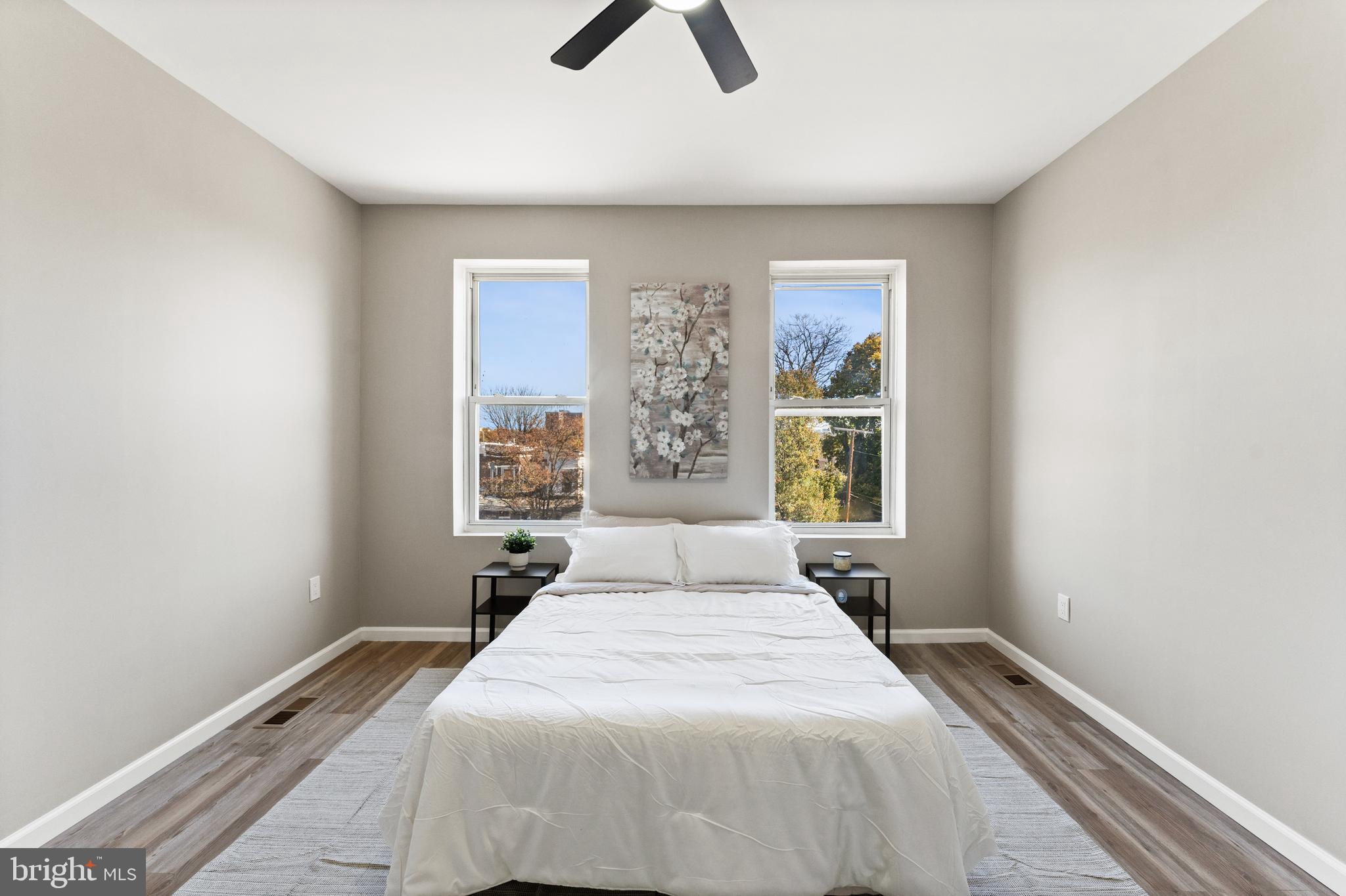 602 Denison Street Baltimore, MD 21229 - Photo 14 of 17 a bedroom with a bed and a window