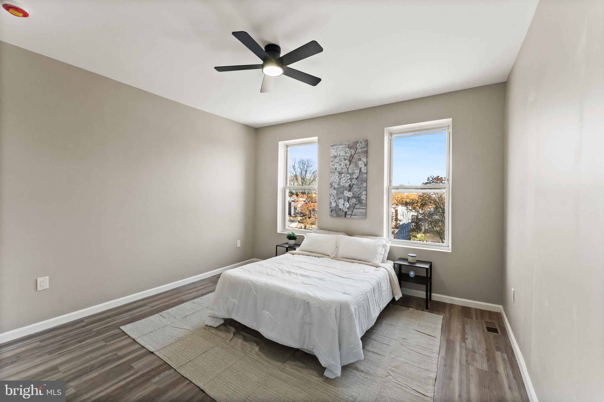 602 Denison Street Baltimore, MD 21229 - Photo 15 of 17 a bedroom with a bed and a window