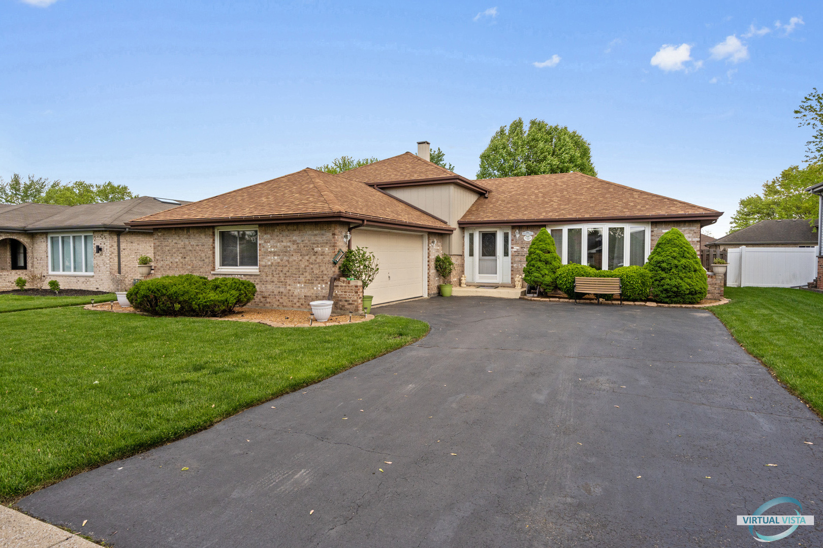 19205 Ada Street Lansing, IL 60438 - Photo 2 of 15 a front view of a house with a garden