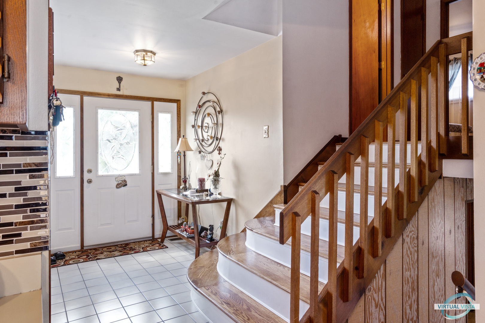 19205 Ada Street Lansing, IL 60438 - Photo 3 of 15 a view of an entryway with wooden floor and stairs