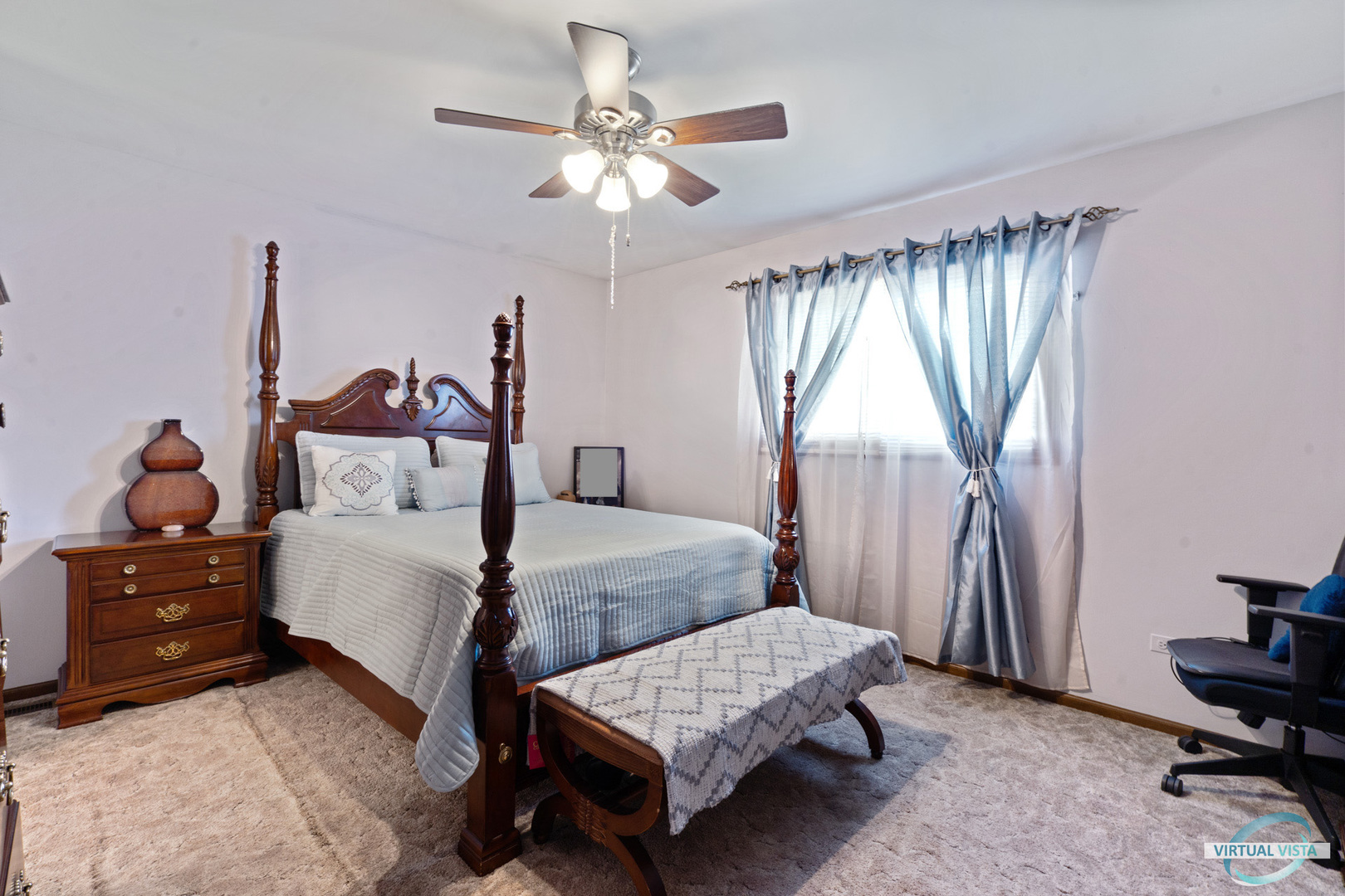 19205 Ada Street Lansing, IL 60438 - Photo 8 of 15 a bedroom with a bed and a chandelier