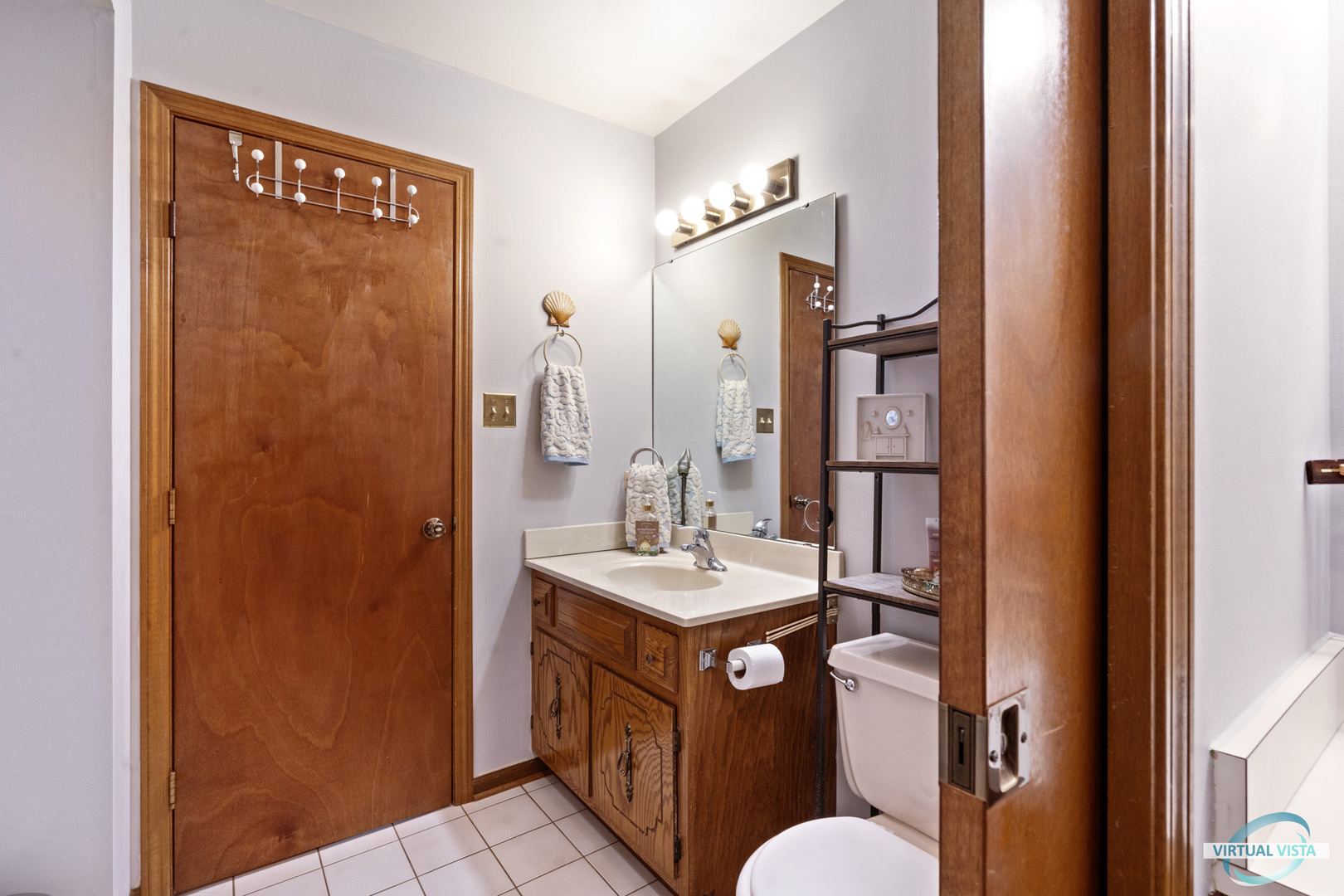 19205 Ada Street Lansing, IL 60438 - Photo 9 of 15 a bathroom with a sink a toilet and shower
