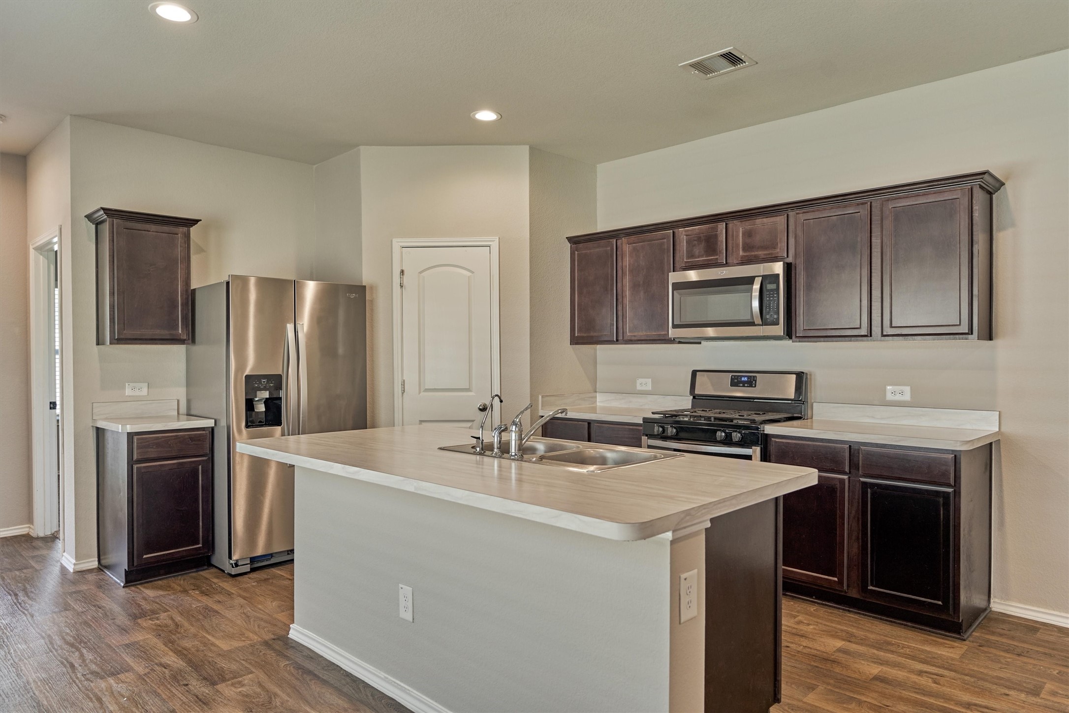 22630 Winter Maple Trail Spring, TX 77373 - Photo 13 of 31 a kitchen that has a sink cabinets and stainless steel appliances