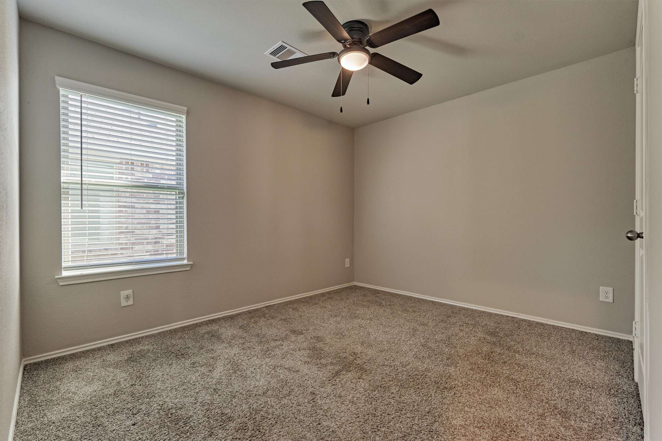 22630 Winter Maple Trail Spring, TX 77373 - Photo 23 of 31 an empty room with a window and a fan