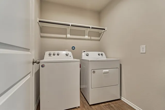 a utility room with dryer and washer