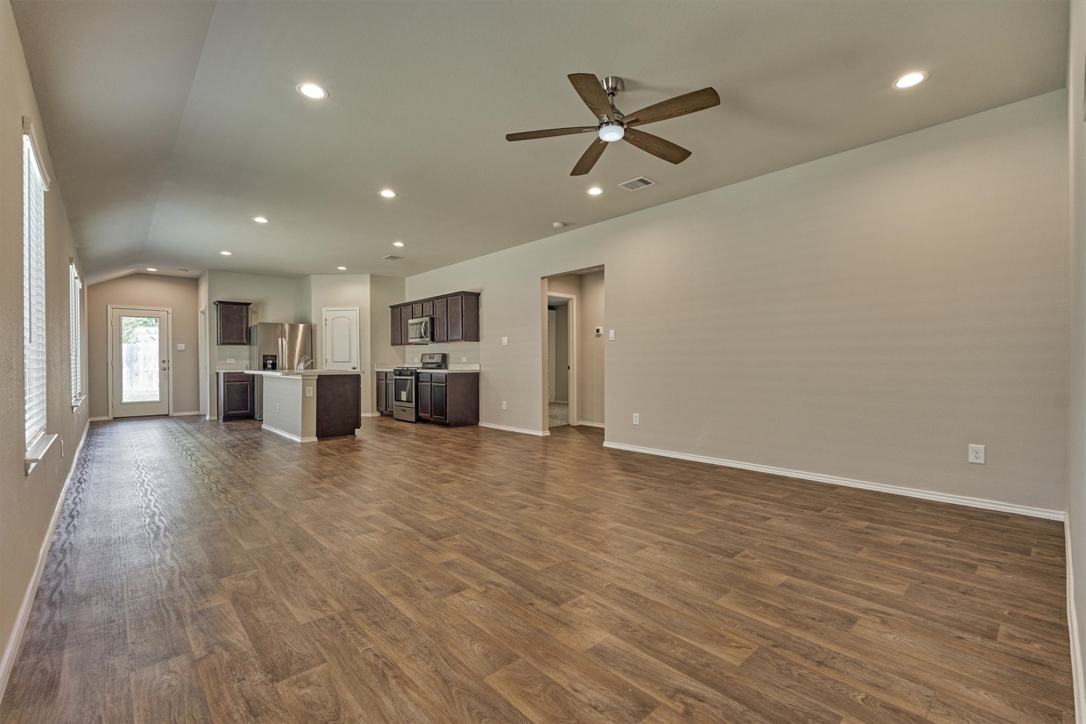 22630 Winter Maple Trail Spring, TX 77373 - Photo 7 of 31 a view of a livingroom with a kitchen