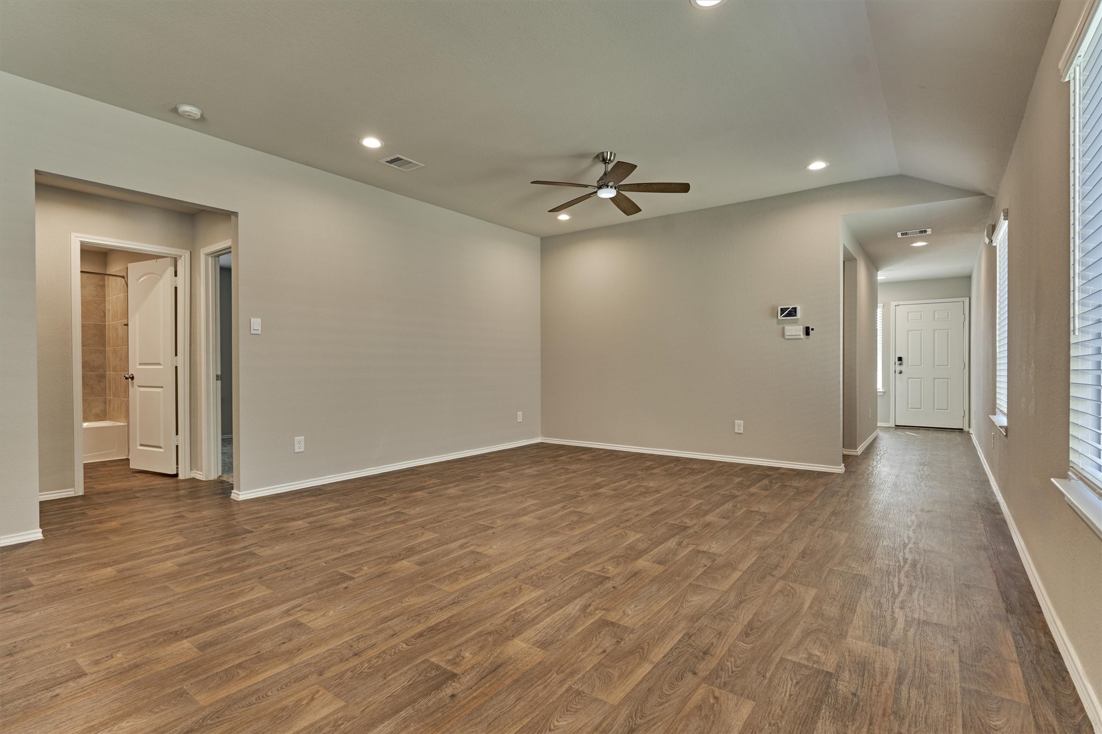 22630 Winter Maple Trail Spring, TX 77373 - Photo 8 of 31 a view of empty room with wooden floor and fan