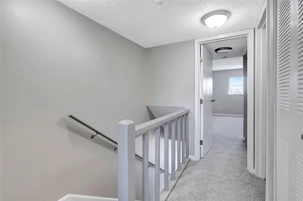 a view of a hallway with closet