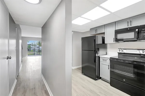 a kitchen with stainless steel appliances a refrigerator and a stove