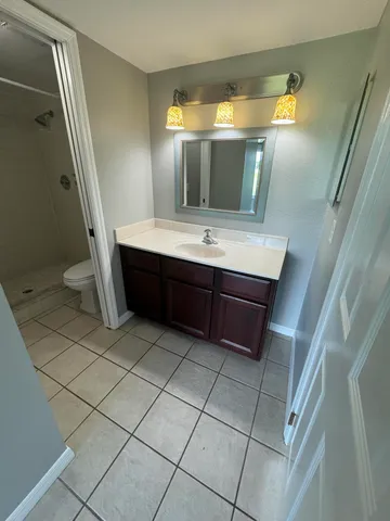 a bathroom with a sink and mirror