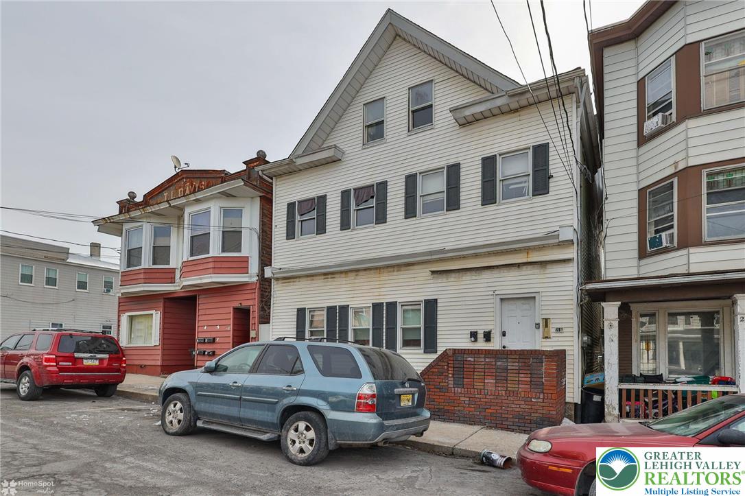 214 West Ridge Street Lansford, PA 18232 - Photo 1 of 52 a car parked in front of a house