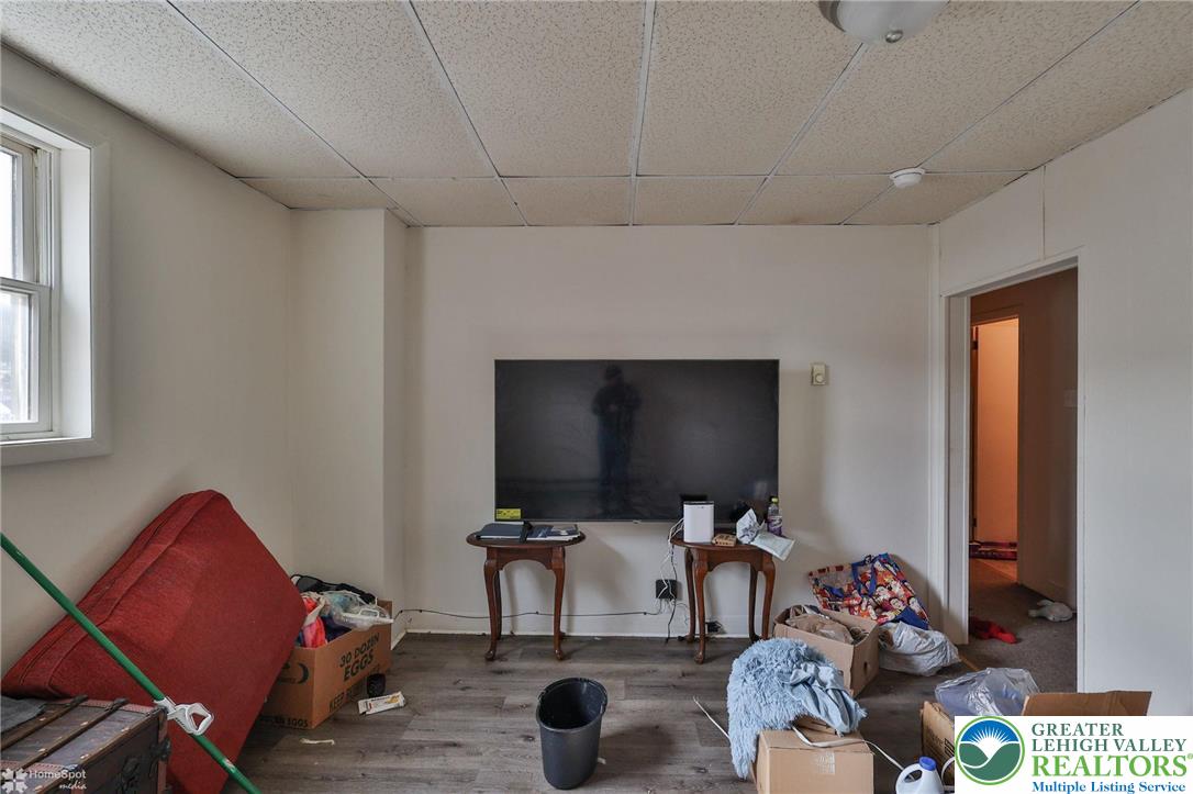 214 West Ridge Street Lansford, PA 18232 - Photo 17 of 52 a living room with furniture and a flat screen tv