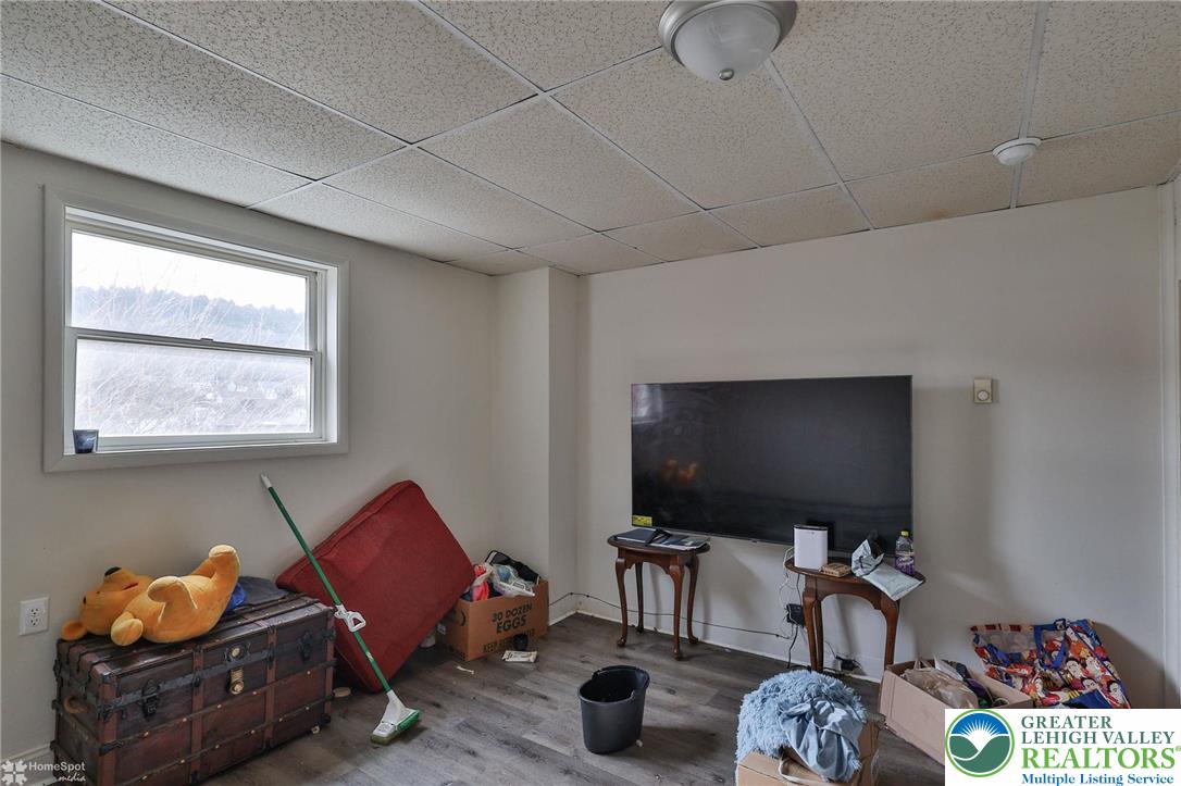 214 West Ridge Street Lansford, PA 18232 - Photo 18 of 52 a living room with furniture and a flat screen tv