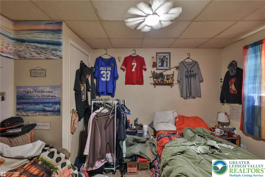 214 West Ridge Street Lansford, PA 18232 - Photo 20 of 52 a bed room with a bed and a mirror